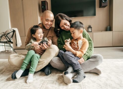 Happy family sitting on the floor