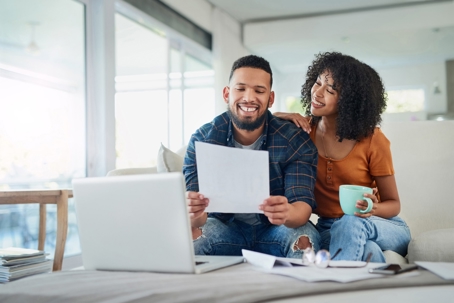 Couple looking at a piece of paper
