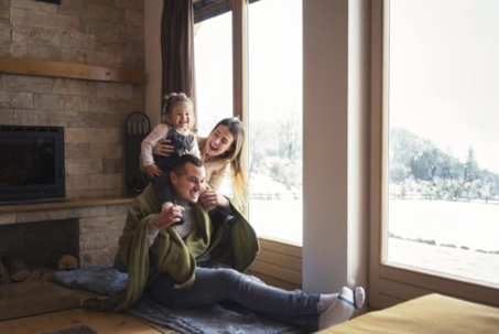 Happy family in their home on a winter day