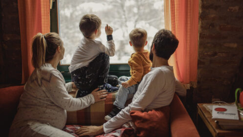 family looking through a window