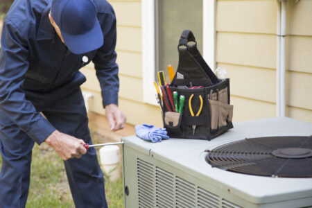 technician checking an HVAC system