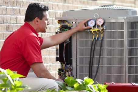 technician checking an HVAC system