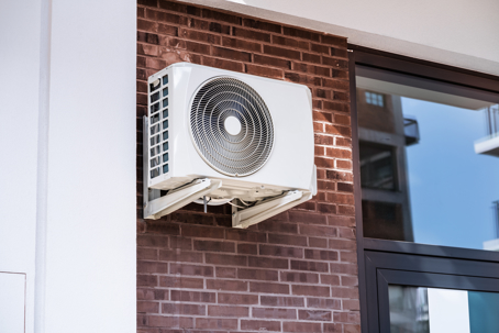 Mini-split system installed on a brick wall