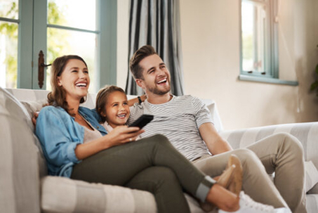 Family sitting on a couch