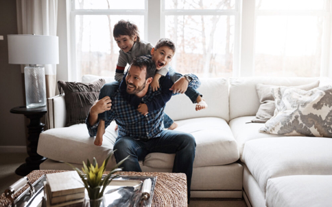 Kids playing with their dad